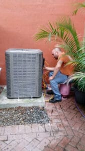 Tech working on AC